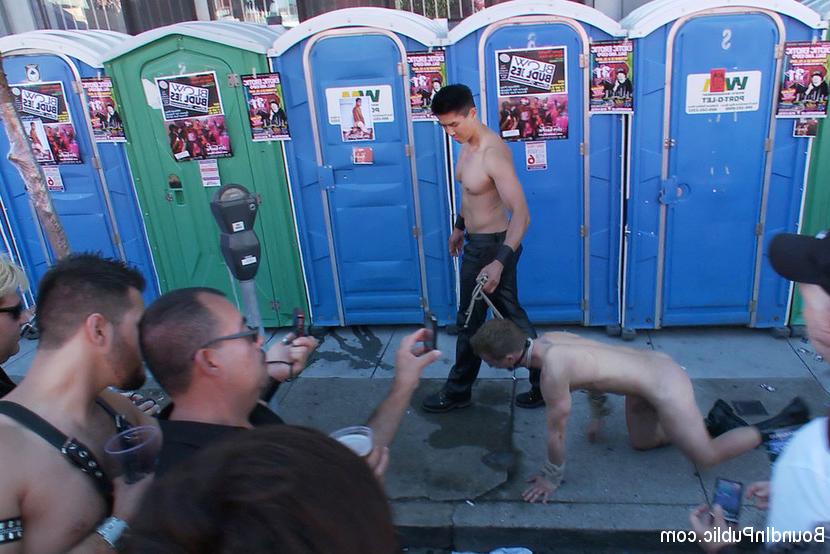15P A sexy stud is stripped naked, humiliated and gang fucked in front of a cheerin