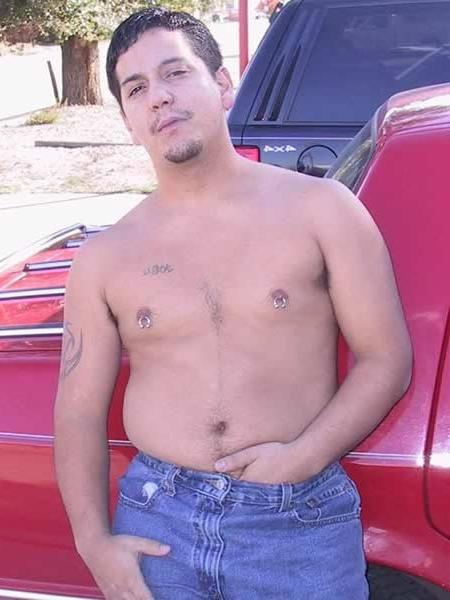 13P Amature guy posing by his red car