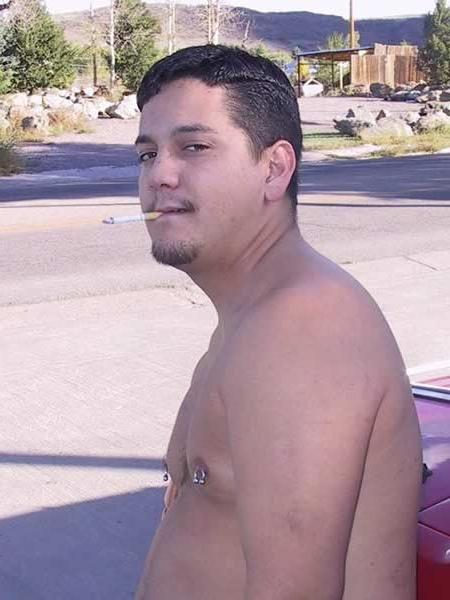 13P Amature guy posing by his red car