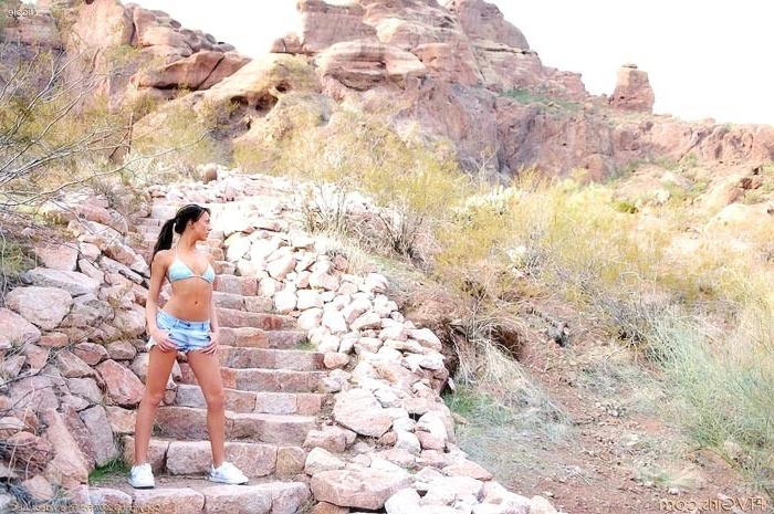 15P Athletic brunette shows tits and pink outside