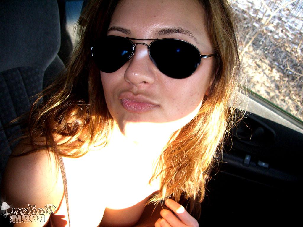 15P Daring teen hottie stripping naked in a moving car