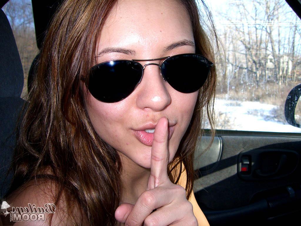 15P Daring teen hottie stripping naked in a moving car