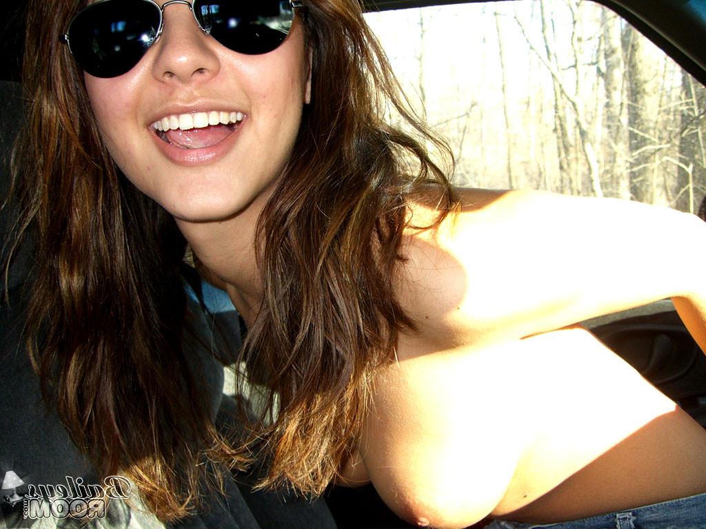 15P Daring teen hottie stripping naked in a moving car