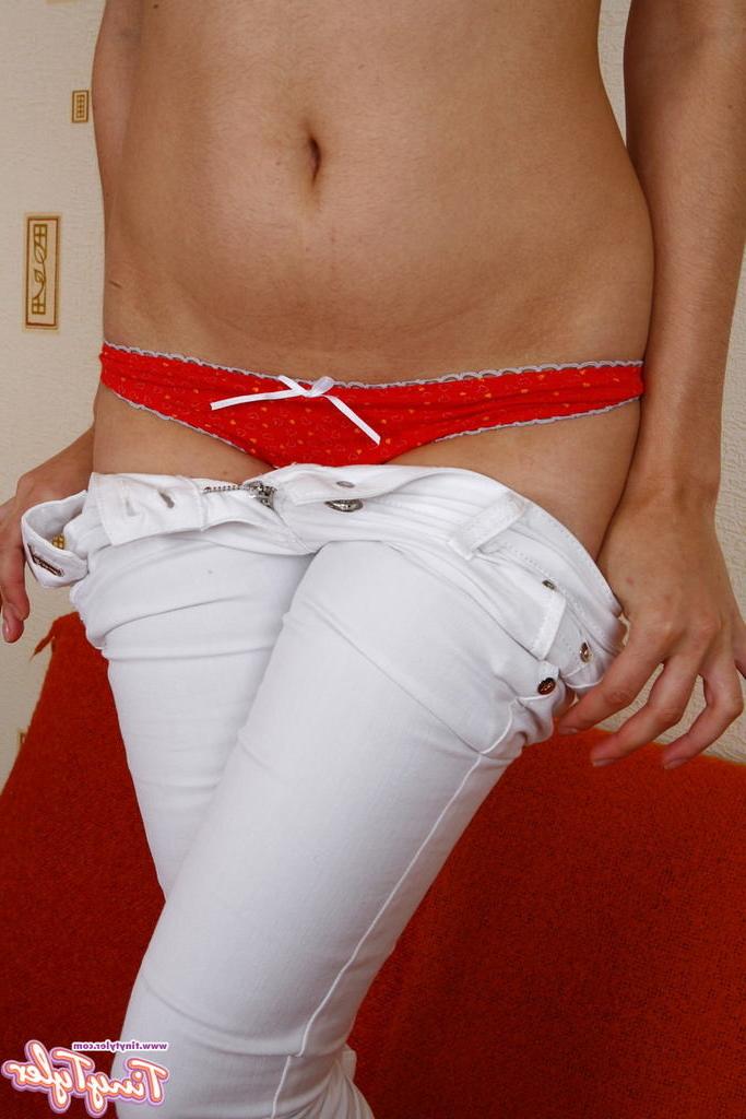 15P Eighteen year old slides down red thong to show her shaved pussy