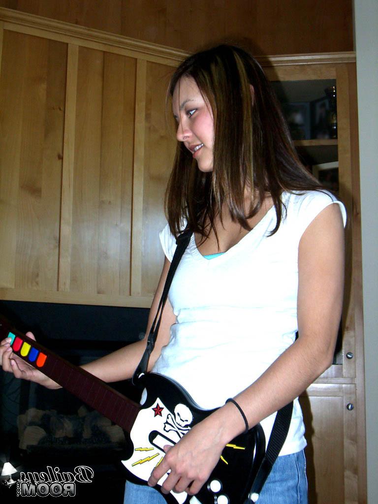 15P Sexy teen gets comfortable playing a video game