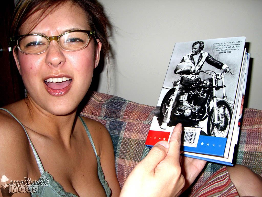 15P Teen babe in glasses reading in her hot pink thong