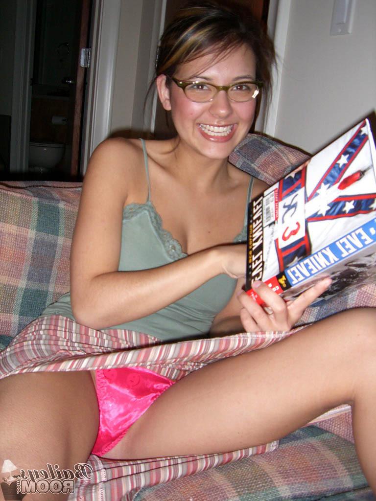 15P Teen babe in glasses reading in her hot pink thong