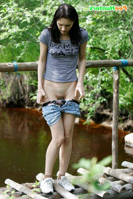 16P Leggy tart peeing from run-down bridge in country