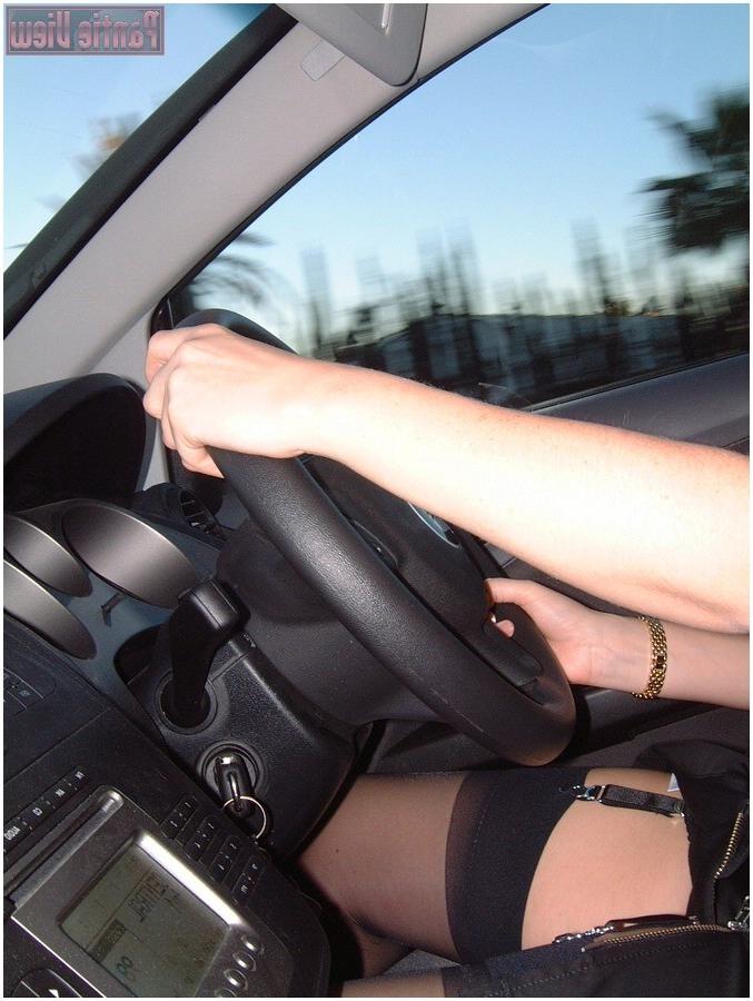 15P While driving here car this girl is showing here black stockings