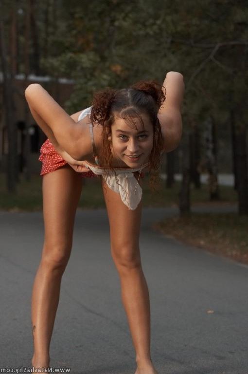 15P Young tiny titted redhead posing outdoors