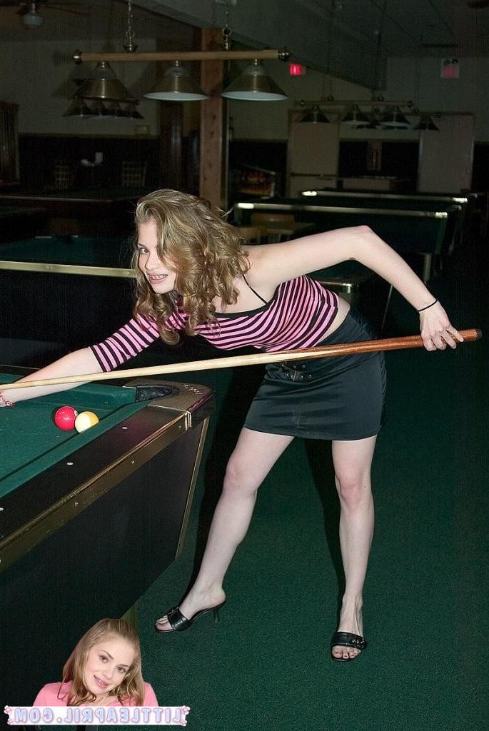 16P Two hot teens playing a hot game of pool together