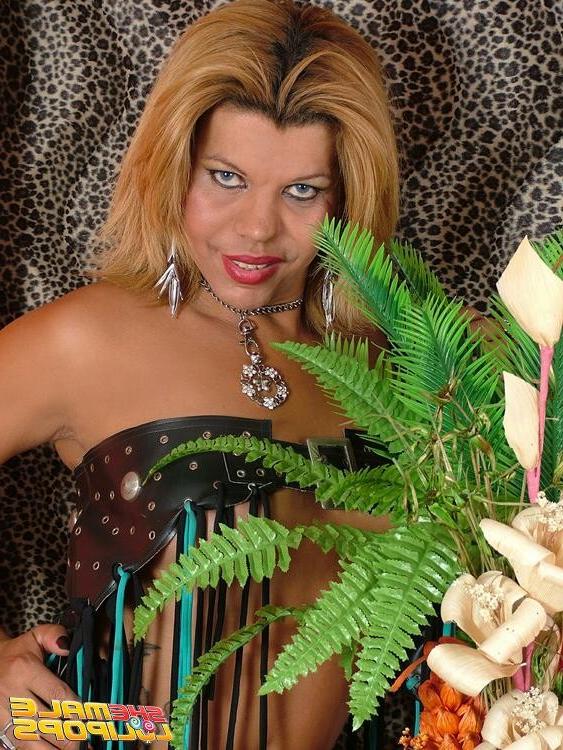 15P Sinfully blonde shemale in big boots Marcela Rios stripping seductively and show