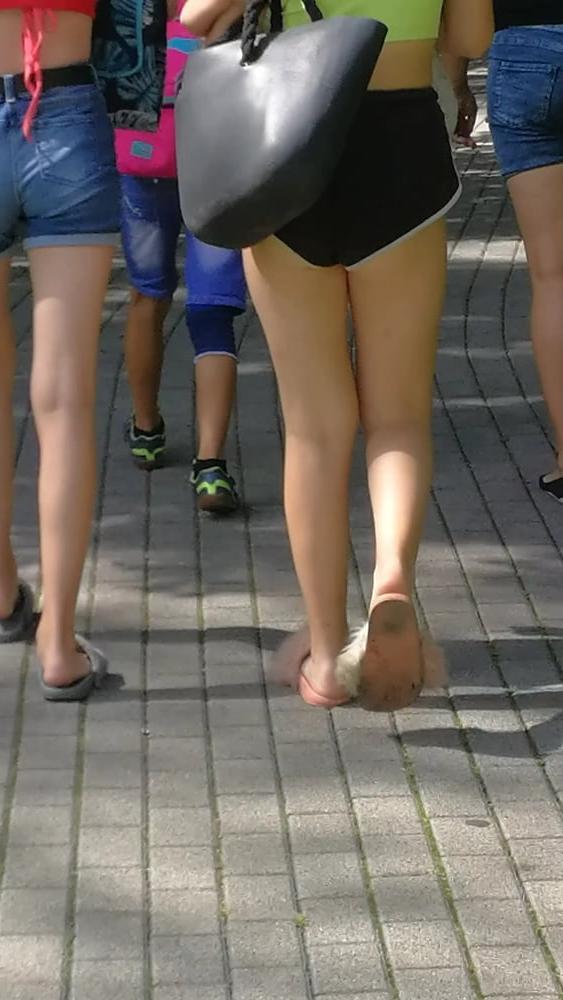 12P Sexy ass of young blonde teen wearing shorts