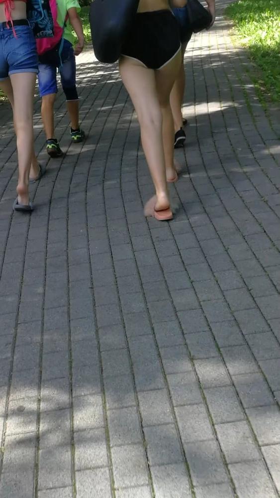 12P Sexy ass of young blonde teen wearing shorts