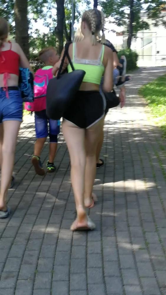 12P Sexy ass of young blonde teen wearing shorts