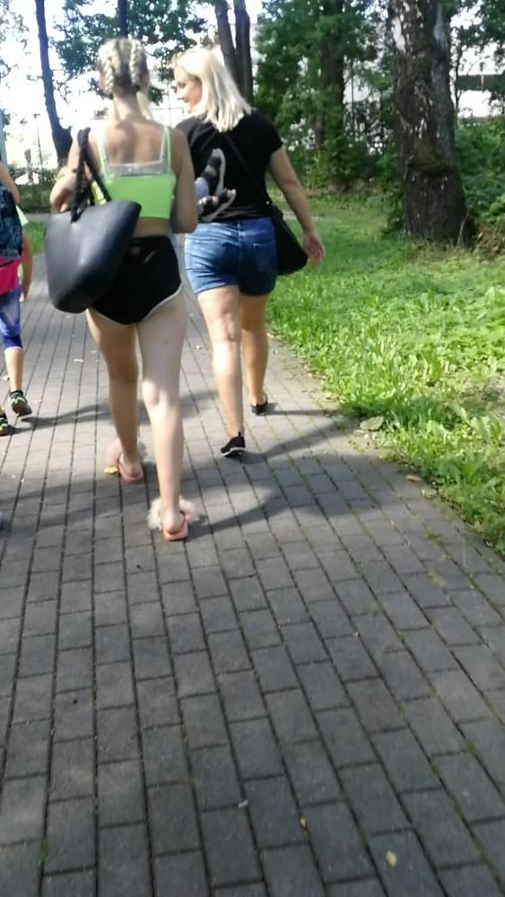 12P Sexy ass of young blonde teen wearing shorts