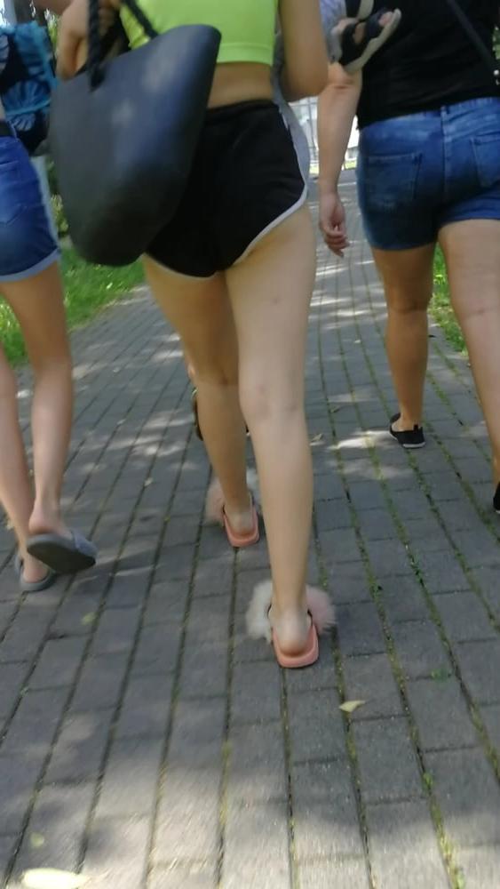 12P Sexy ass of young blonde teen wearing shorts