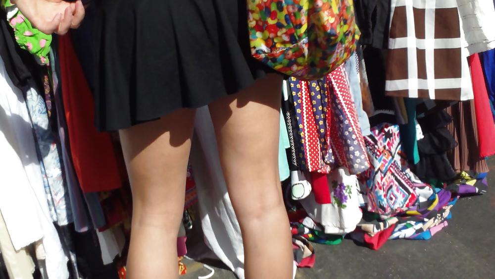 25P Hot teen girl in short black skirt with nice legs