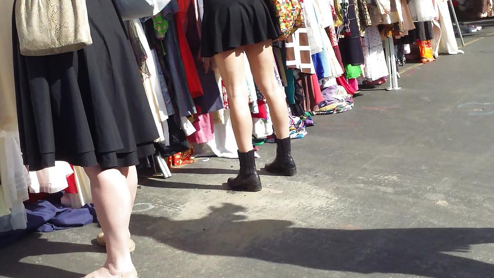 25P Hot teen girl in short black skirt with nice legs