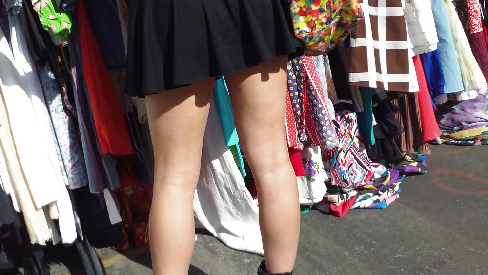25P Hot teen girl in short black skirt with nice legs