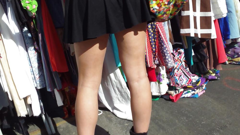 25P Hot teen girl in short black skirt with nice legs