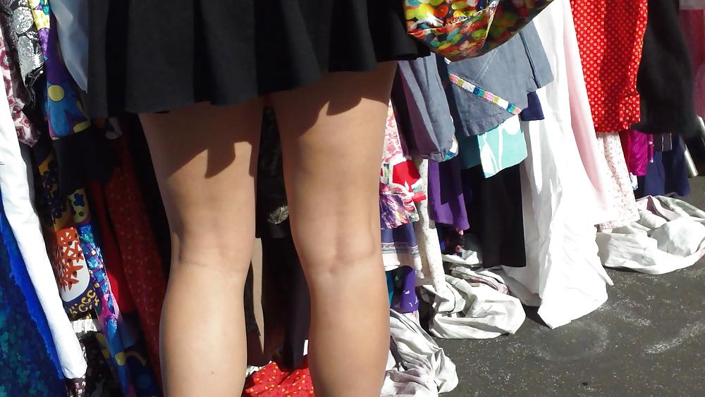 25P Hot teen girl in short black skirt with nice legs