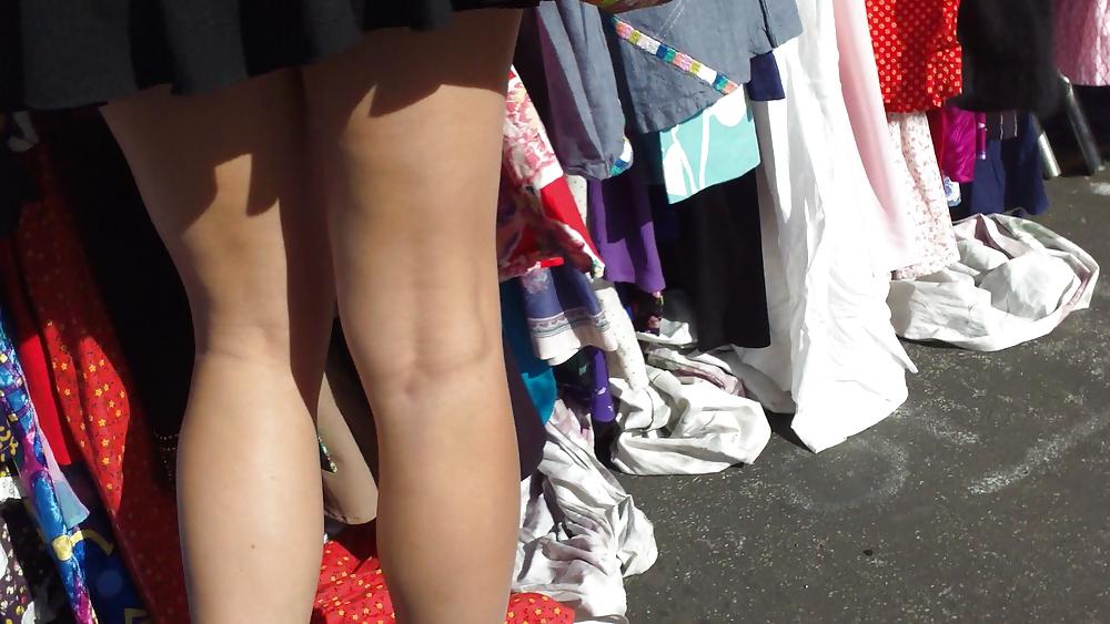 25P Hot teen girl in short black skirt with nice legs