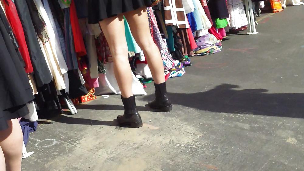 25P Hot teen girl in short black skirt with nice legs