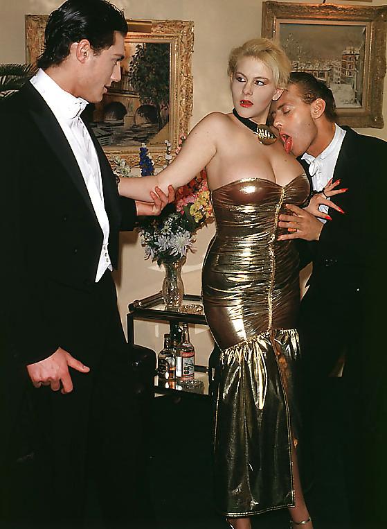 20P Blonde in golden dress taking a couple of guys