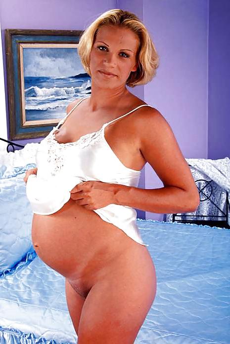 15P Pregnant blonde posing her big belly