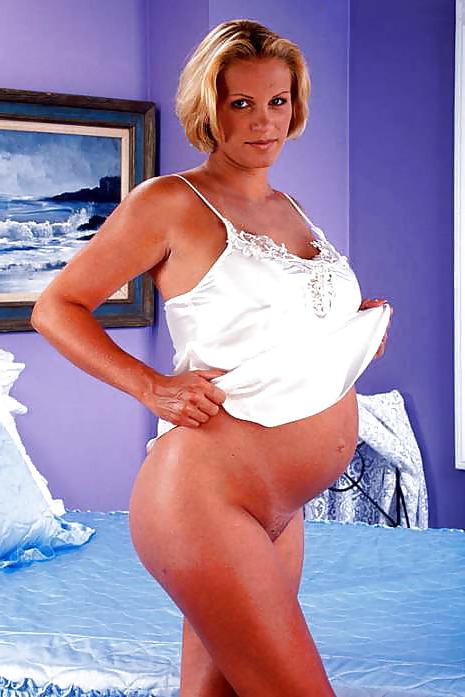 15P Pregnant blonde posing her big belly