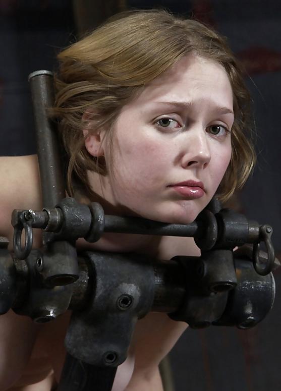 25P Slave strapped to metal frame and ride wooden