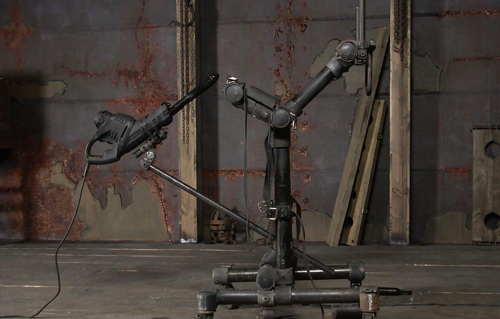 25P Slave strapped to metal frame and ride wooden
