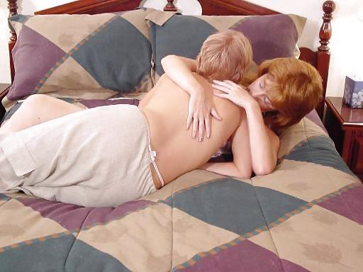14P Ex-wife and daughter's friend posing on the bed