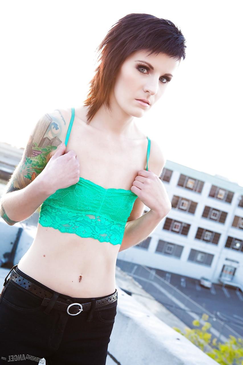 15P Skinny alt babe with tattooed body exposing tiny tits outdoors on rooftop
