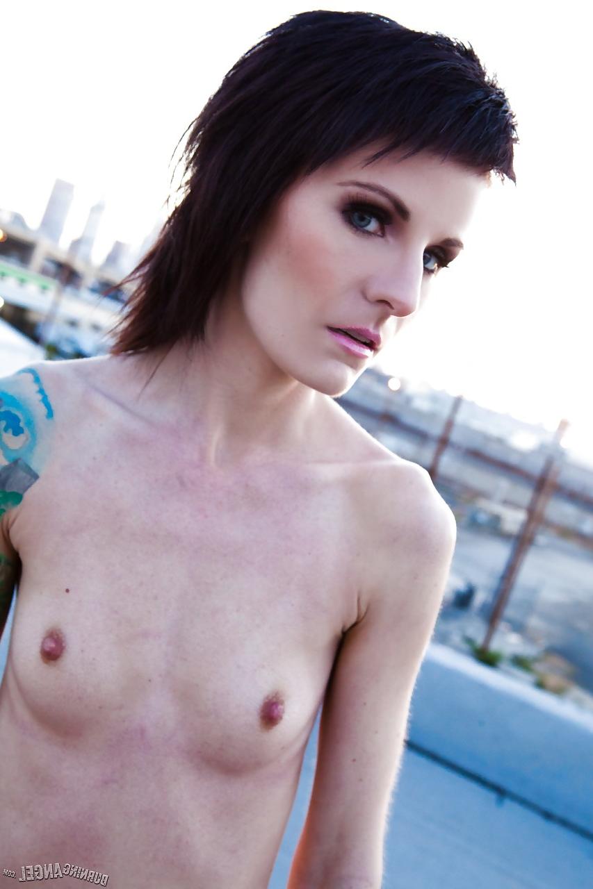 15P Skinny alt babe with tattooed body exposing tiny tits outdoors on rooftop