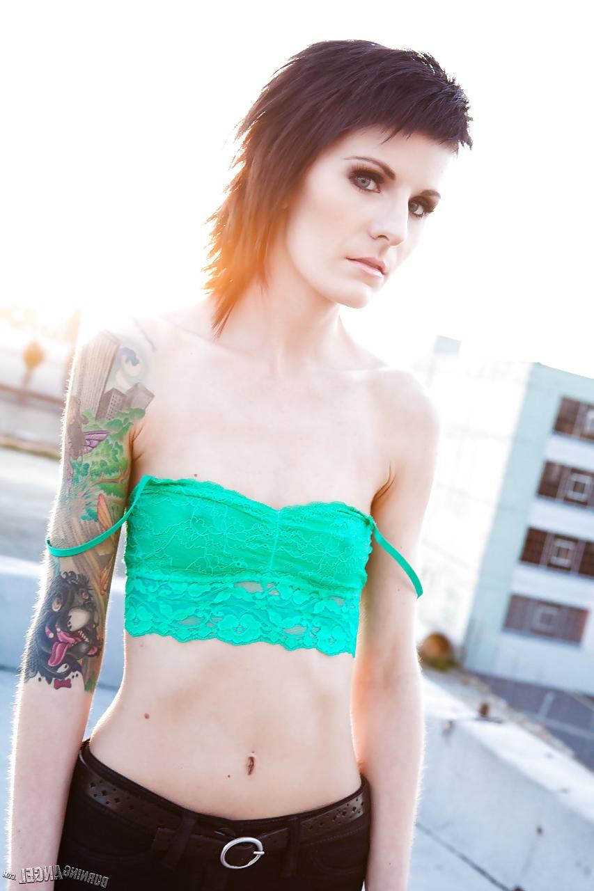 15P Skinny alt babe with tattooed body exposing tiny tits outdoors on rooftop