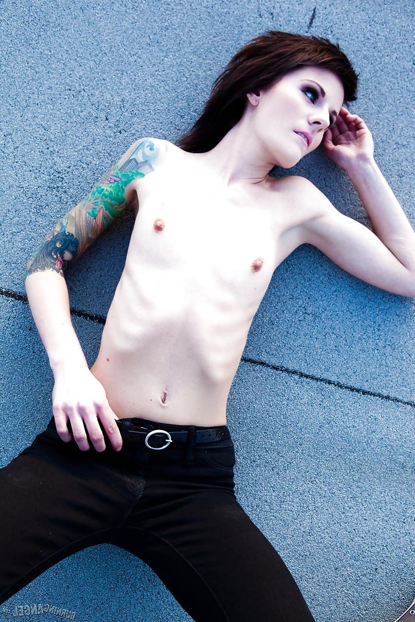 15P Skinny alt babe with tattooed body exposing tiny tits outdoors on rooftop