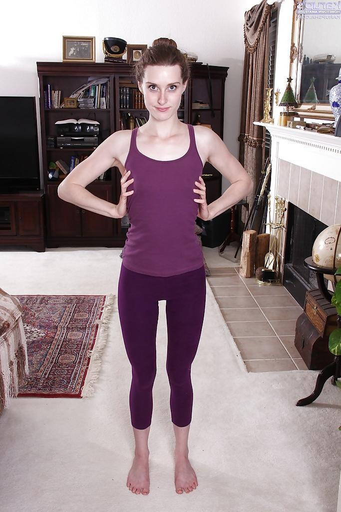 16P Slender amateur chick Tara Estell undressing after yoga session to model naked