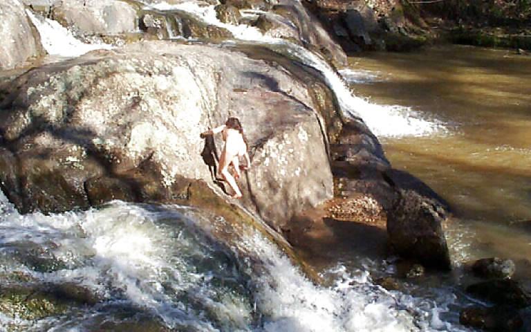 25P Brunette skinny-dipping in river