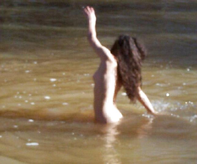 25P Brunette skinny-dipping in river