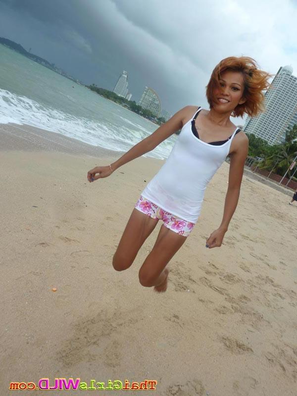 16P Skinny thai poses and shows her pussy on the beach