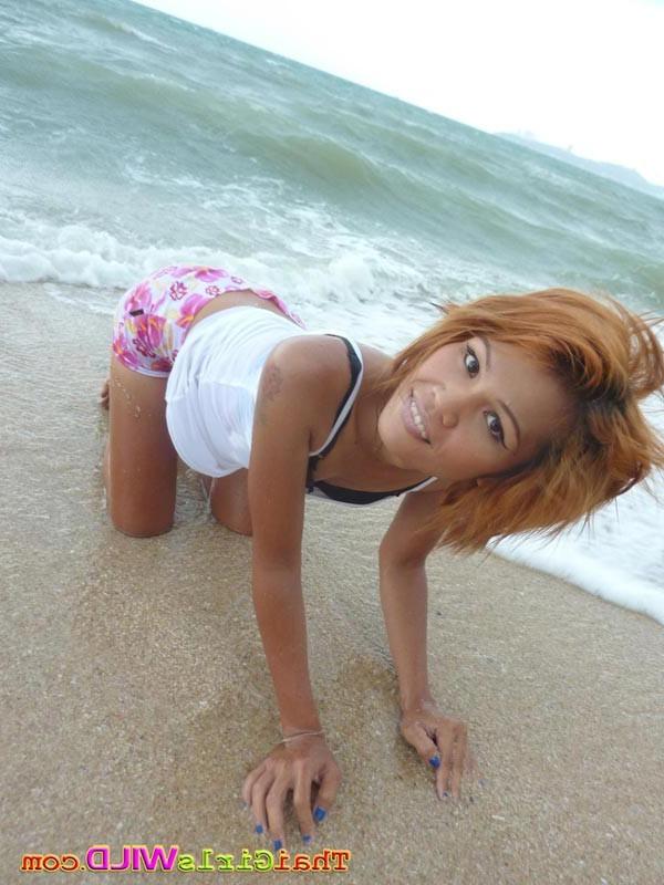 16P Skinny thai poses and shows her pussy on the beach