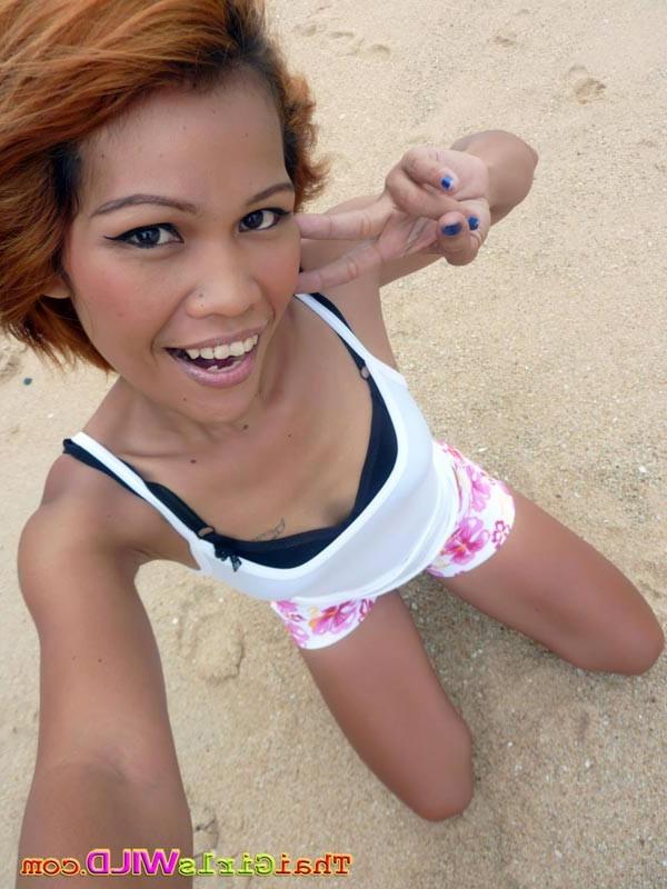 16P Skinny thai poses and shows her pussy on the beach