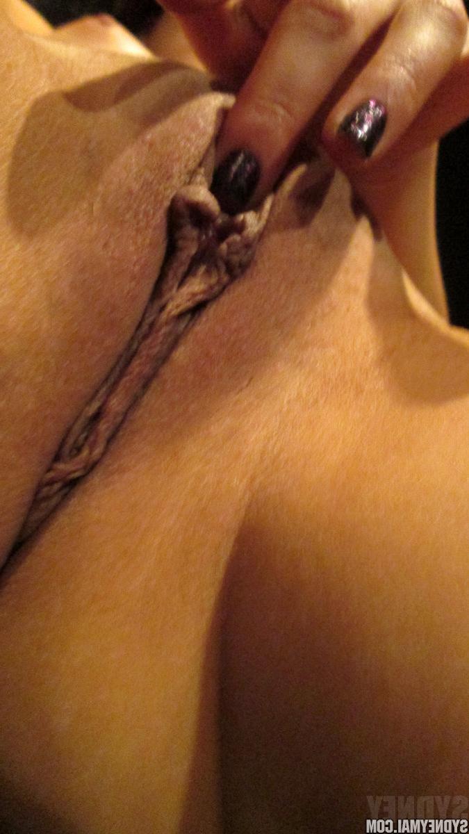 15P Beautiful Sydney Mai fingers her luscious pussy in closeup pics