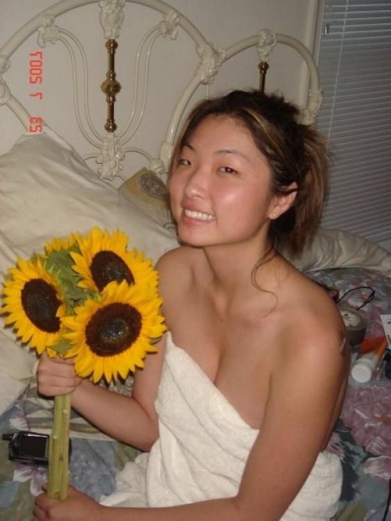 16P Asian does a stiptease befoe sliding her pussy on huge cock