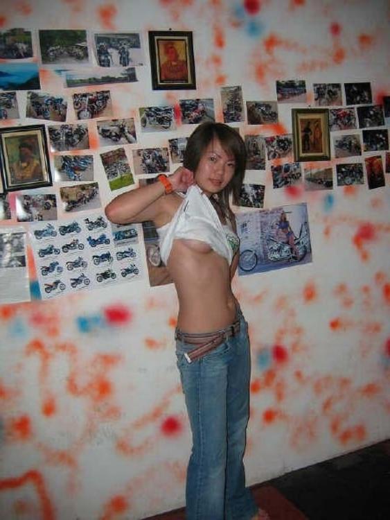 16P Asian does a stiptease befoe sliding her pussy on huge cock
