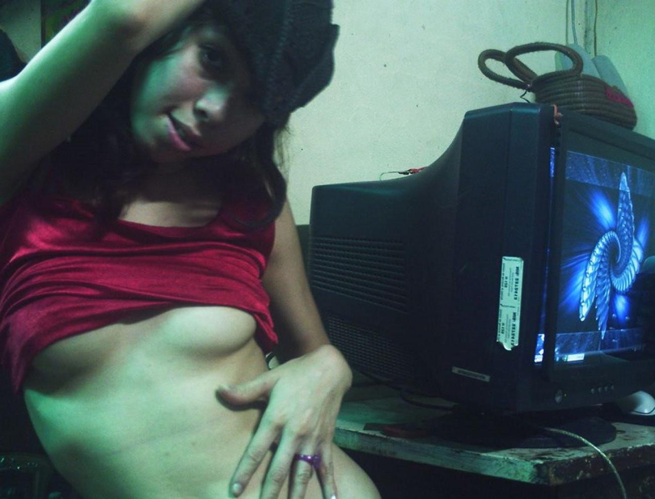16P Asian does a stiptease befoe sliding her pussy on huge cock