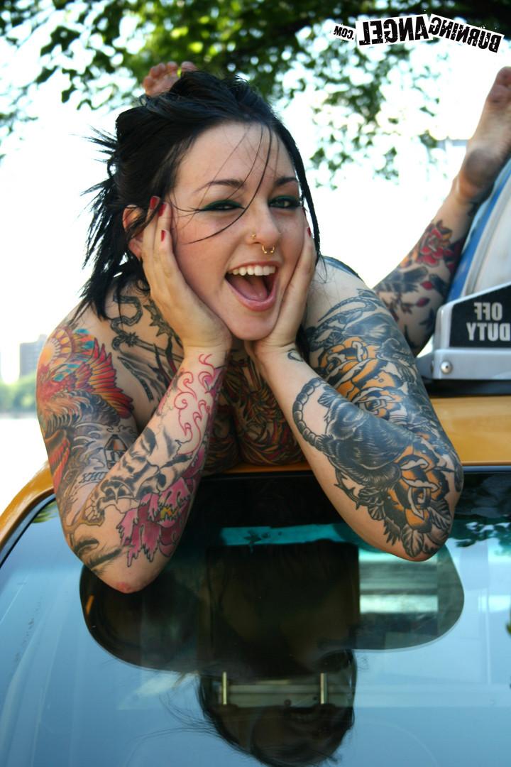 15P Tattooed slut strips outdoors