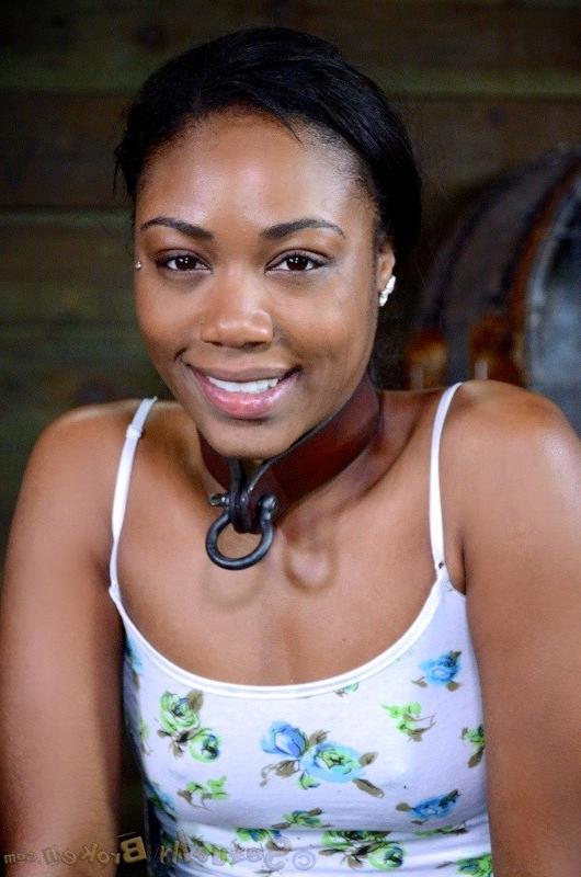 16P Chanell Heart ebony babe is caged and made to suck cock